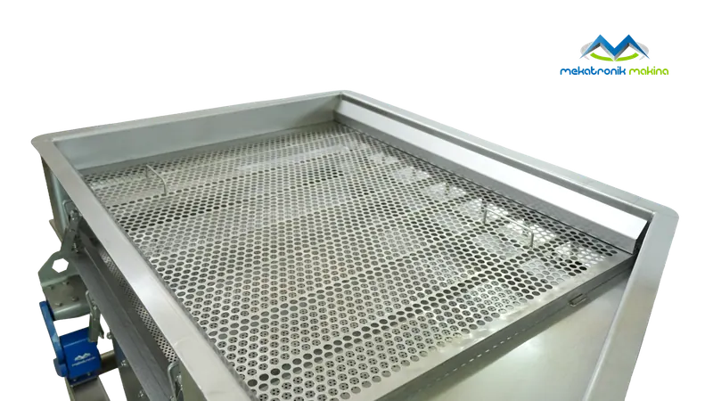Close-up of a perforated stainless steel screen surface